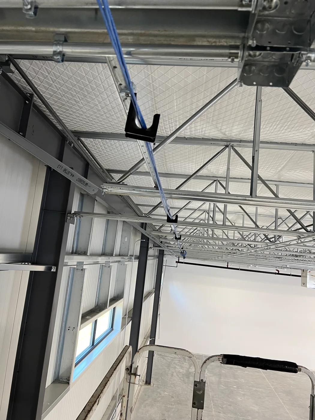 Ceiling cable tray run in a commercial warehouse in Maine