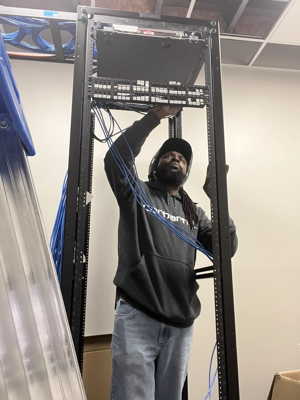 Rayon of Sovun Technologies installing a network rack