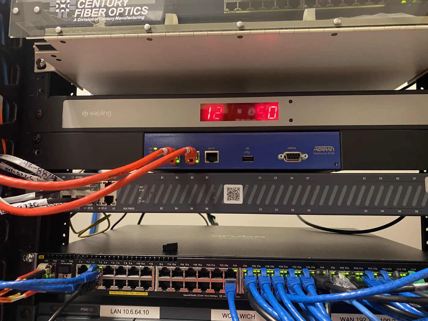 Network switch and patch panel with blue Cat6 cabling