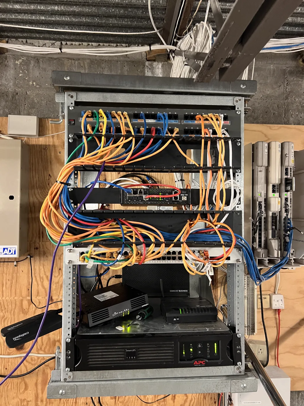 Wall-mounted network board with patch cabling