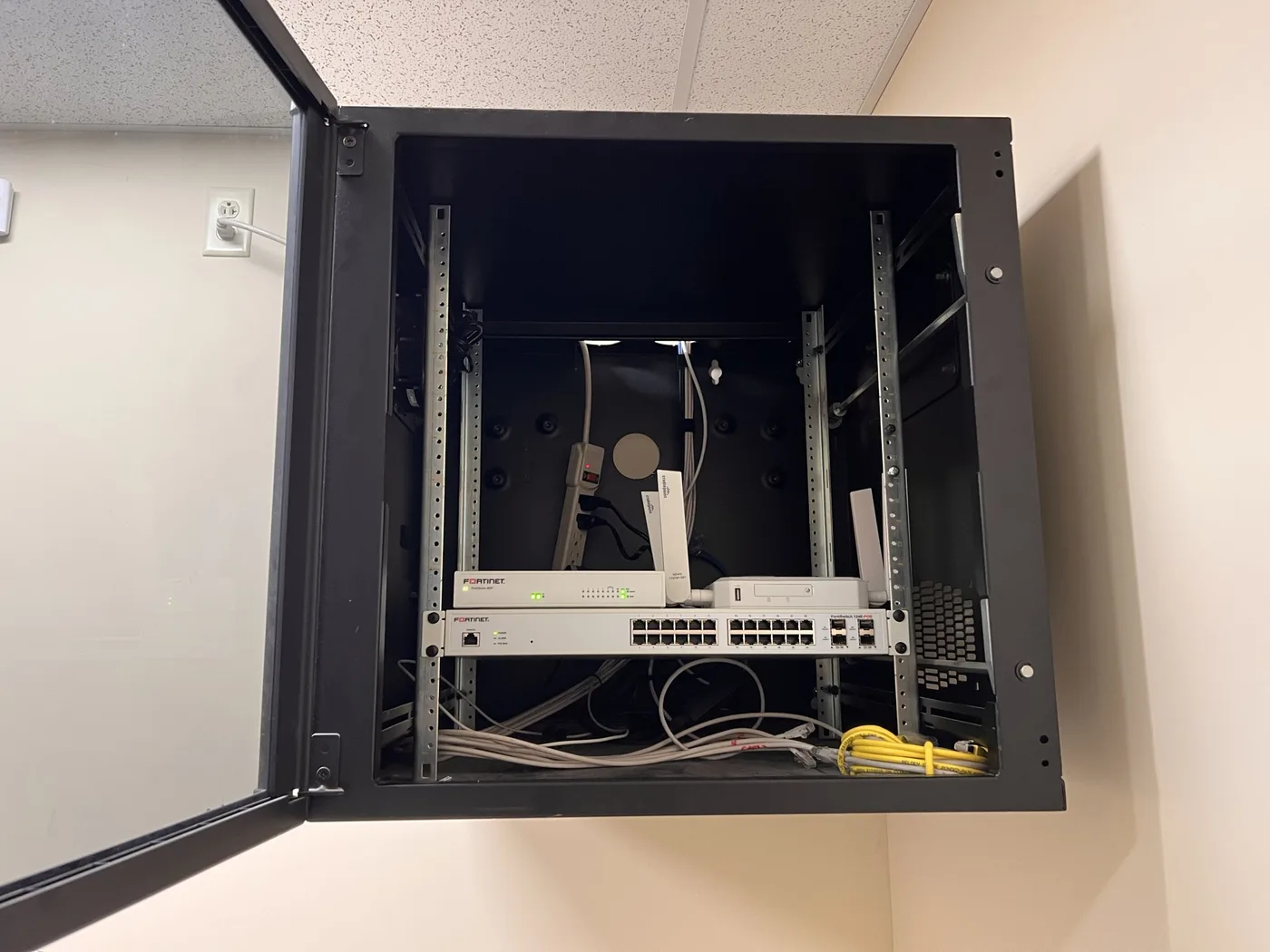 Wall-mounted network cabinet with switch, clean and organized