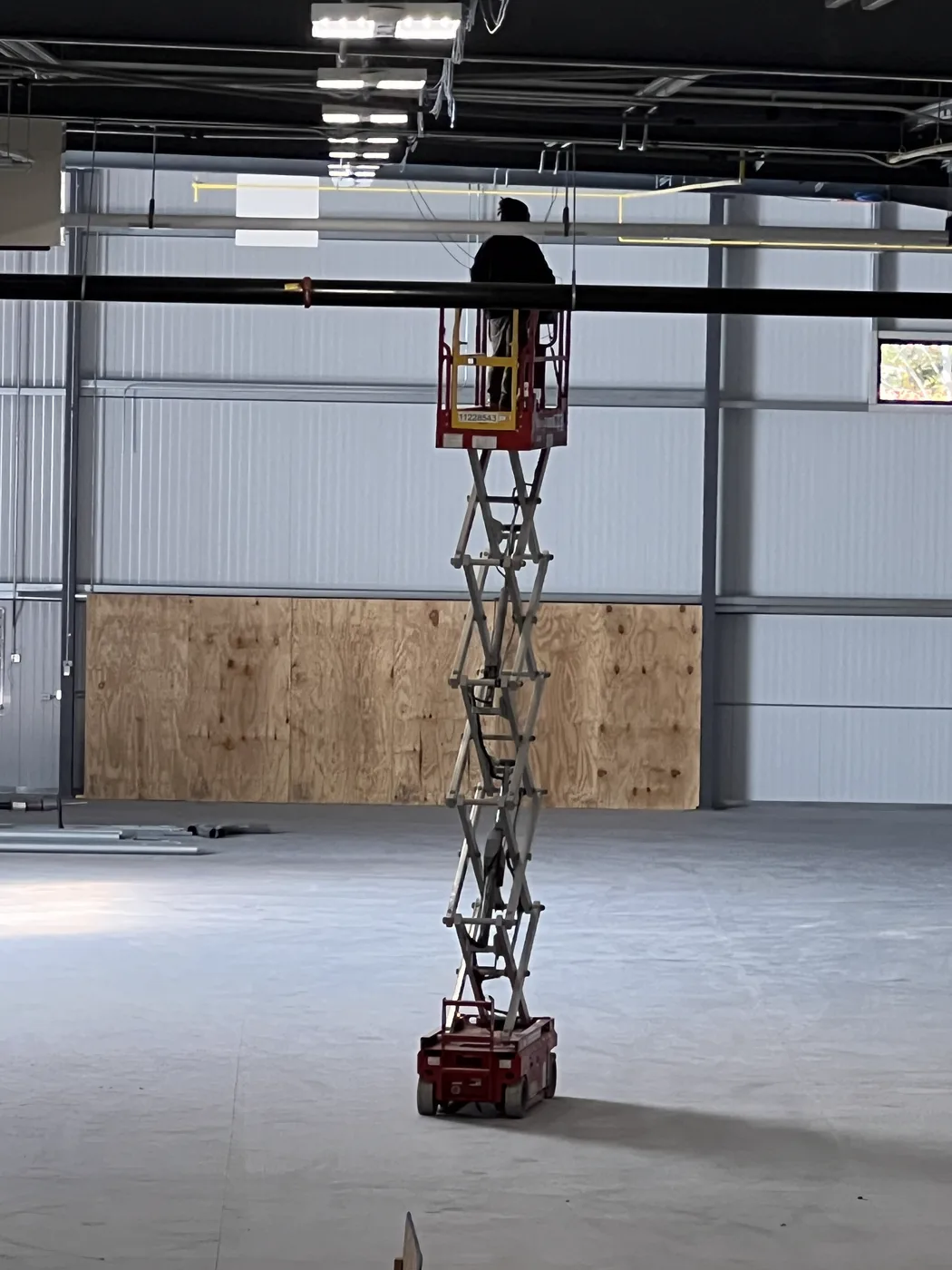 Ceiling cabling work from a scissor lift